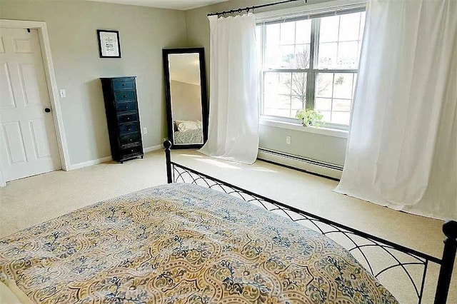 unfurnished bedroom with carpet, baseboards, and baseboard heating