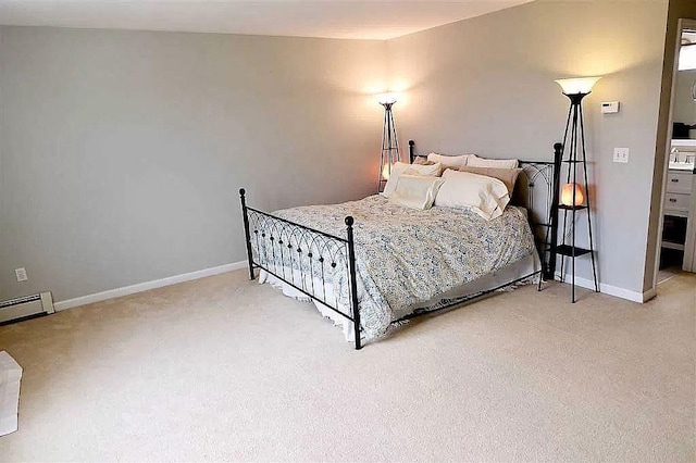 bedroom with a baseboard radiator, baseboards, and light colored carpet