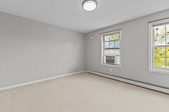 unfurnished room with a wealth of natural light, light colored carpet, baseboards, and baseboard heating