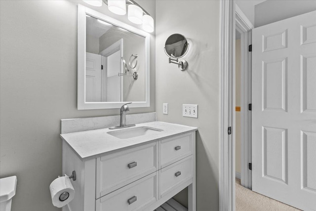 bathroom featuring toilet and vanity