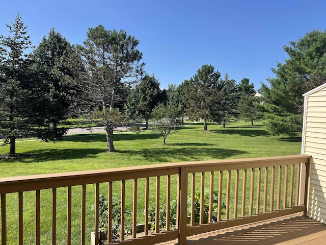 deck featuring a lawn