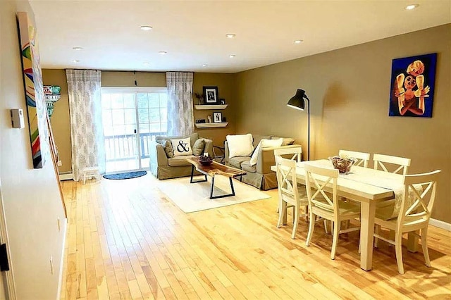 dining space featuring recessed lighting, baseboards, and hardwood / wood-style flooring