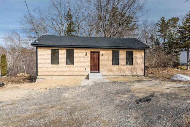 view of front of home featuring a shingled roof