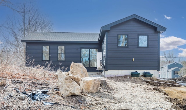 view of front of house with a shingled roof