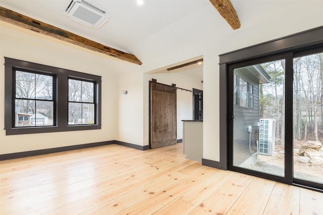 empty room featuring a wealth of natural light, visible vents, vaulted ceiling with beams, and light wood finished floors