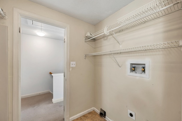 laundry room with baseboards, hookup for an electric dryer, hookup for a washing machine, and laundry area