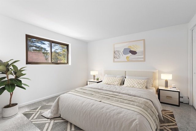 carpeted bedroom with baseboards and baseboard heating