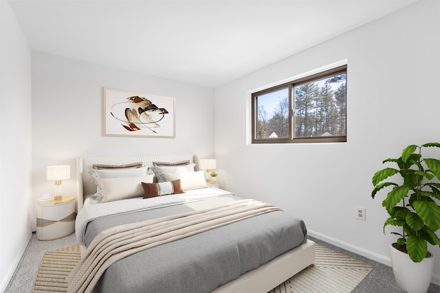 carpeted bedroom featuring baseboards