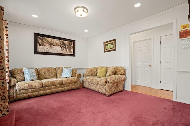 carpeted living area with recessed lighting and crown molding