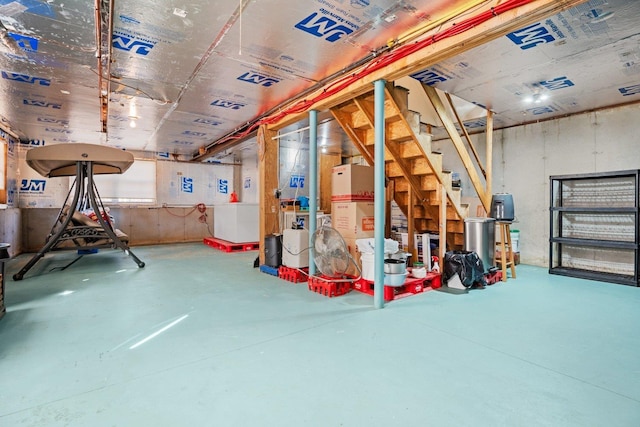 unfinished basement with stairway