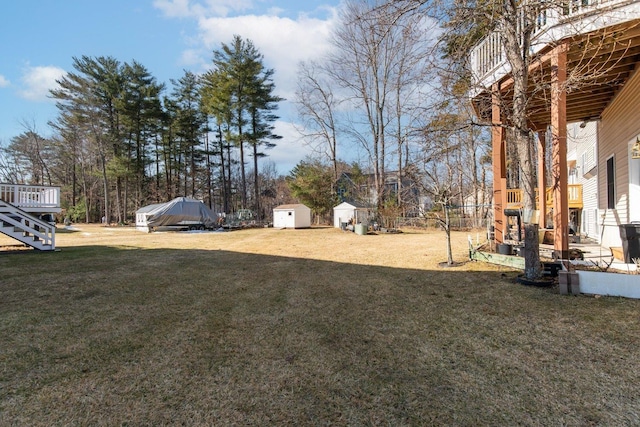 view of yard with an outdoor structure and a storage unit