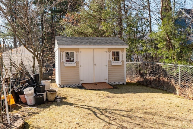 view of shed with a fenced backyard