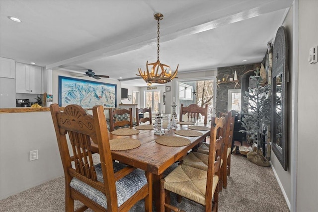 dining room with light carpet, beamed ceiling, ceiling fan with notable chandelier, and recessed lighting