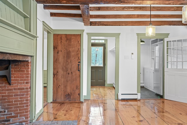 foyer with hardwood / wood-style floors, beamed ceiling, and baseboard heating