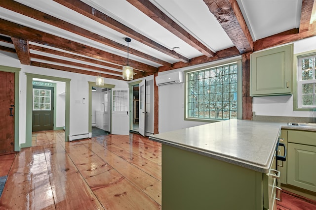 kitchen with a wall mounted AC, a peninsula, green cabinets, light wood-type flooring, and baseboard heating