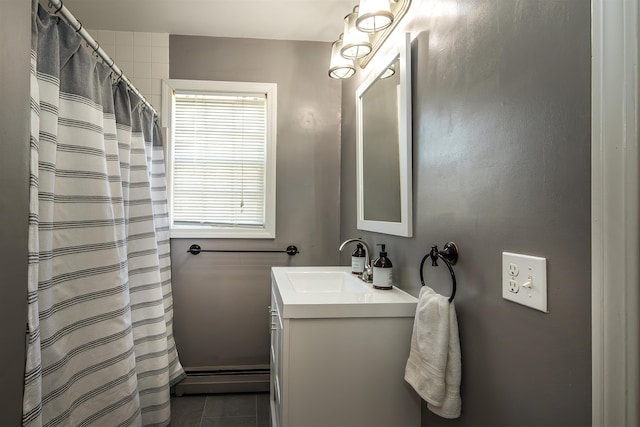 bathroom with vanity, tile patterned floors, a shower with curtain, and baseboard heating