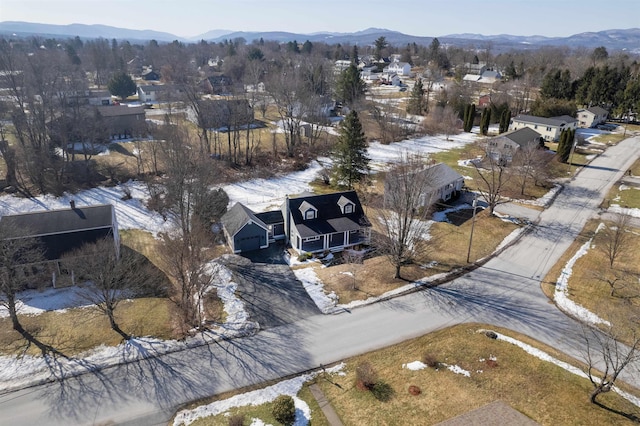 birds eye view of property featuring a mountain view and a residential view