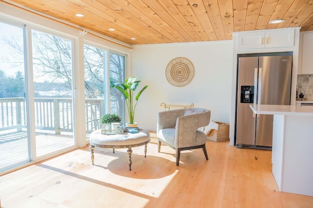 sitting room featuring recessed lighting, wooden ceiling, ornamental molding, and light wood finished floors