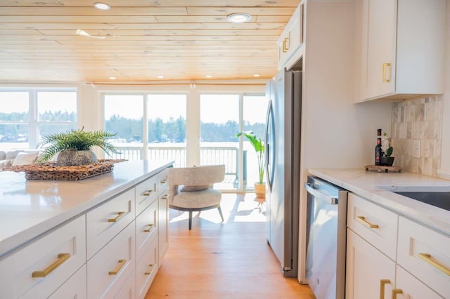 kitchen with light wood-style flooring, tasteful backsplash, recessed lighting, stainless steel appliances, and wooden ceiling