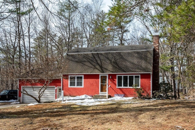 dutch colonial with an attached garage, roof with shingles, a chimney, and entry steps