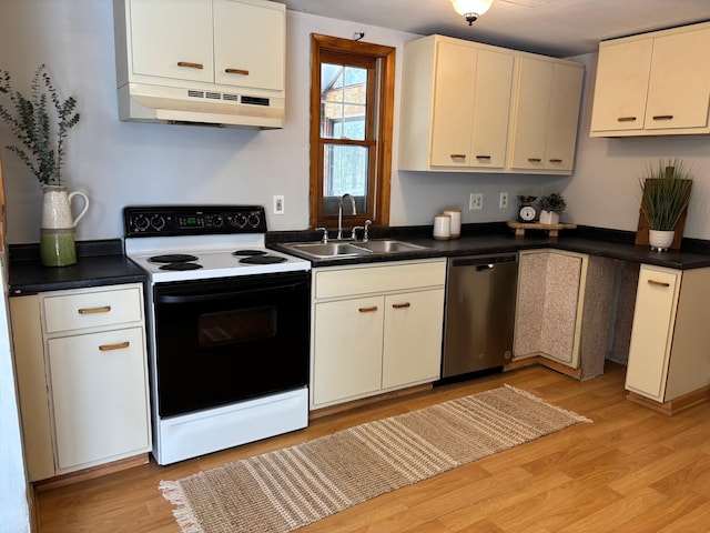 kitchen with under cabinet range hood, dishwasher, light wood-style flooring, range with electric stovetop, and a sink