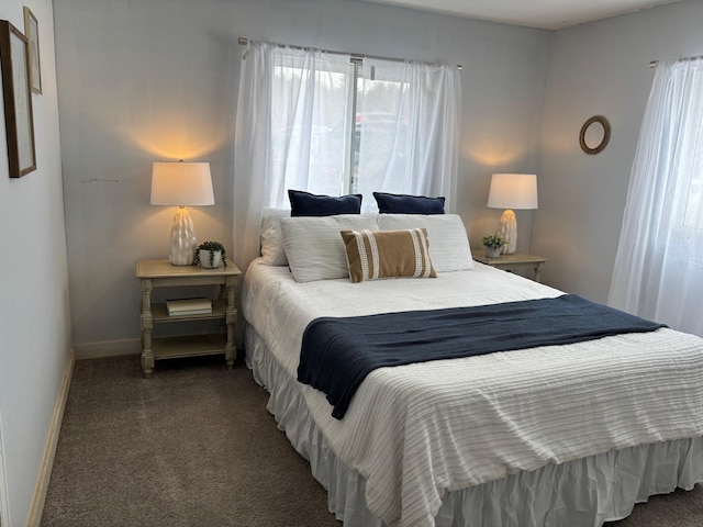 carpeted bedroom with baseboards