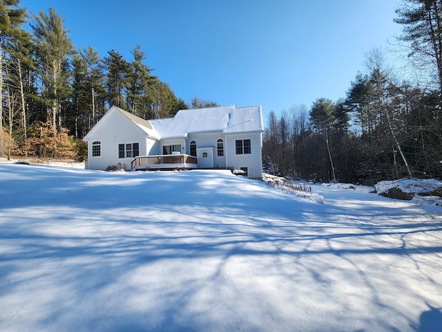 view of front of home with a deck and stucco siding