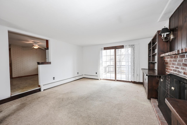 unfurnished living room with a baseboard heating unit, a ceiling fan, brick wall, and light carpet