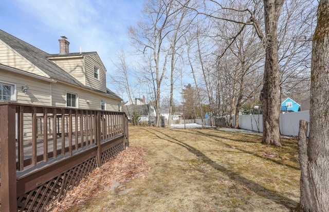 view of yard featuring a wooden deck and fence private yard