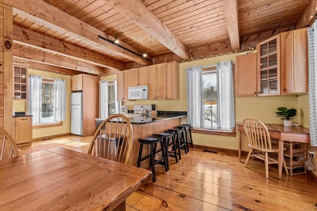 kitchen featuring light wood finished floors, white appliances, wood ceiling, and light brown cabinetry