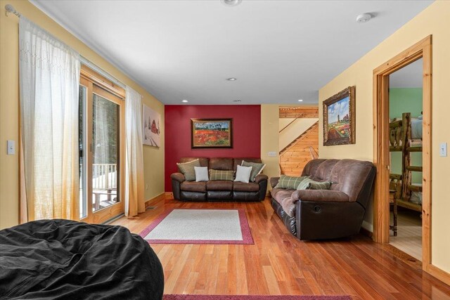 living room with baseboards and wood finished floors