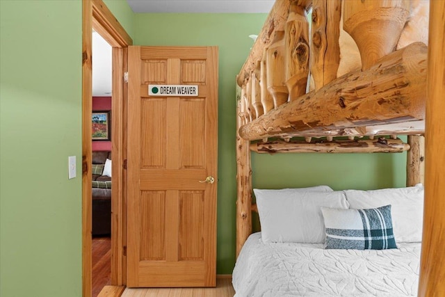 bedroom with wood finished floors