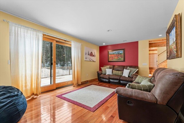 living area featuring light wood finished floors and recessed lighting