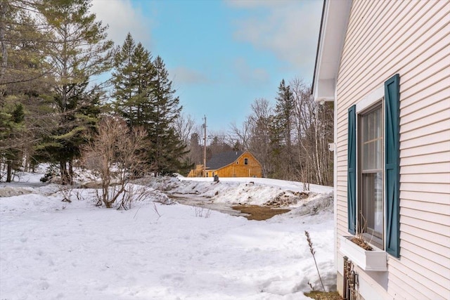 view of yard covered in snow