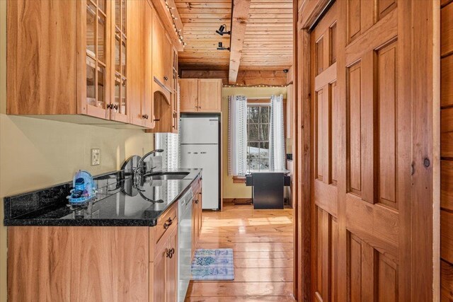 kitchen with beamed ceiling, a sink, wood ceiling, freestanding refrigerator, and dishwasher