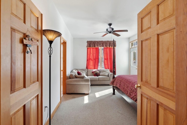 bedroom with ceiling fan, baseboards, and light carpet