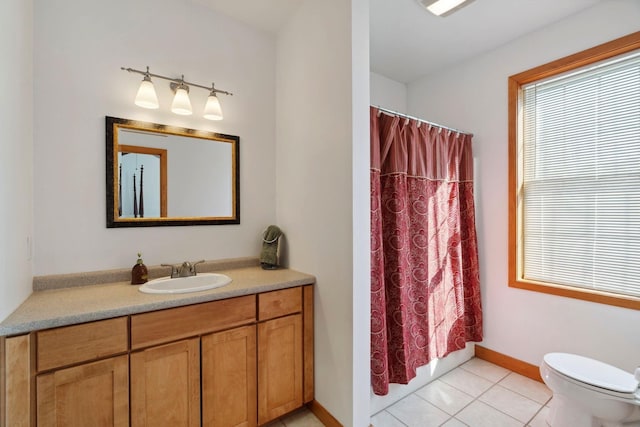 full bath featuring vanity, a shower with shower curtain, baseboards, tile patterned flooring, and toilet