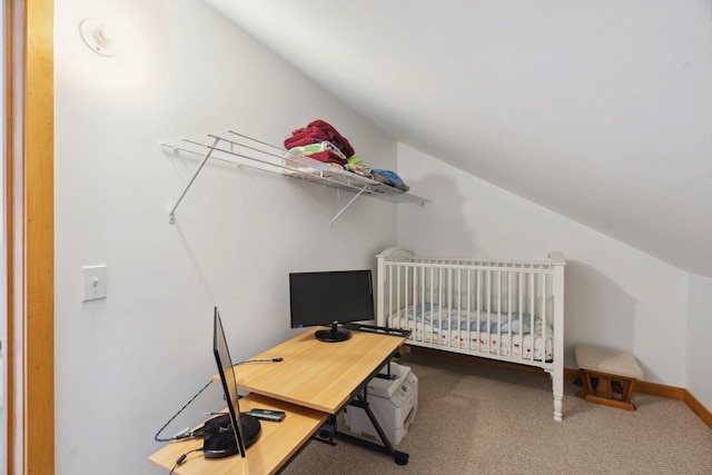 carpeted bedroom featuring baseboards and vaulted ceiling