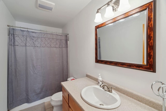 bathroom featuring visible vents, curtained shower, toilet, and vanity