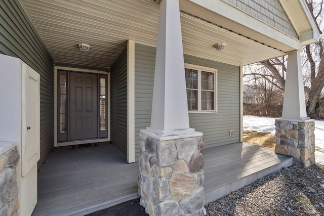 doorway to property featuring covered porch