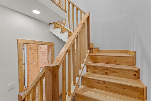 staircase featuring recessed lighting