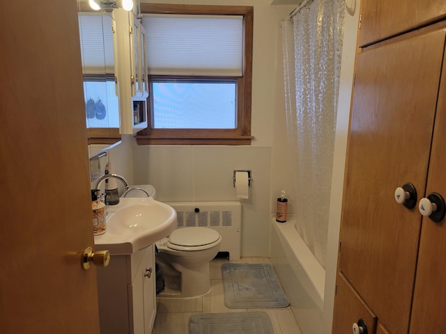 full bath featuring tile patterned floors, radiator, toilet, and vanity