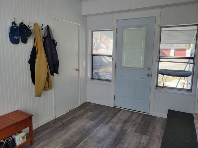 entrance foyer with dark wood-type flooring and baseboards