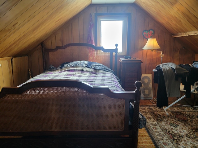 bedroom with wooden walls, wooden ceiling, and vaulted ceiling