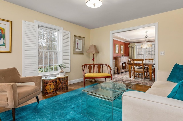 living area with wood finished floors and baseboards