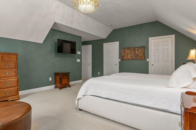 bedroom featuring a chandelier, light colored carpet, baseboards, and lofted ceiling