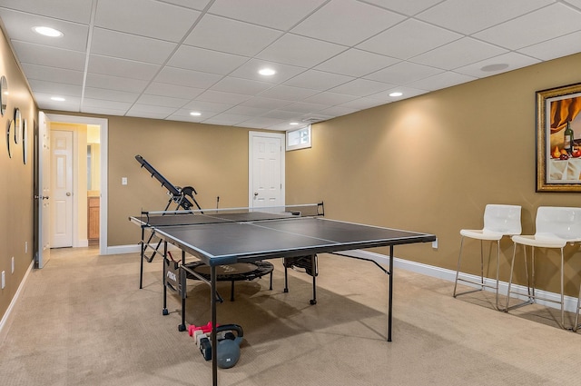 game room with recessed lighting, light colored carpet, baseboards, and a paneled ceiling