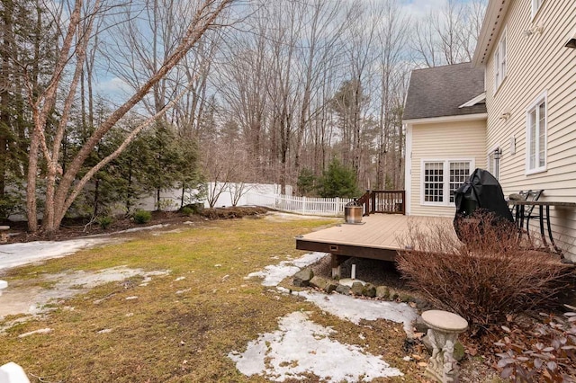 view of yard with a wooden deck and fence