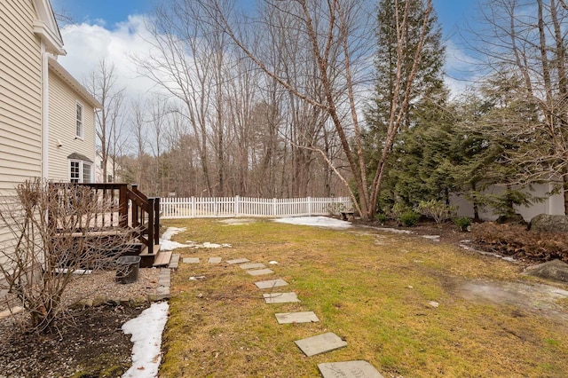 view of yard with a wooden deck and fence