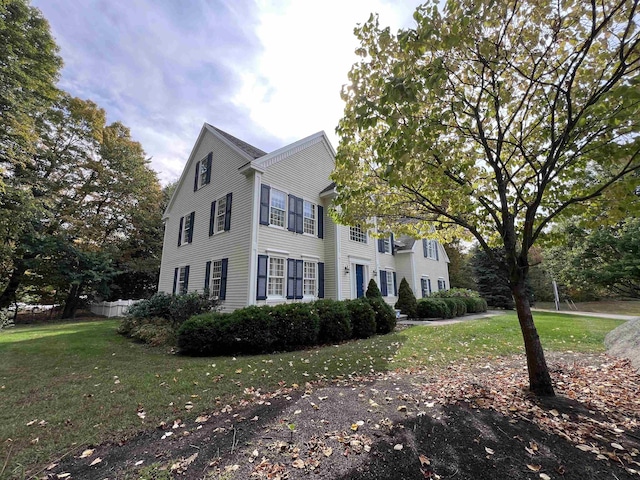 colonial home with a front yard